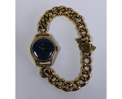  A Lady’s Reglia 18ct Gold Wristwatch manual, the blue circular dial on a gold curb-link bracelet, distress the dial 20mm dia