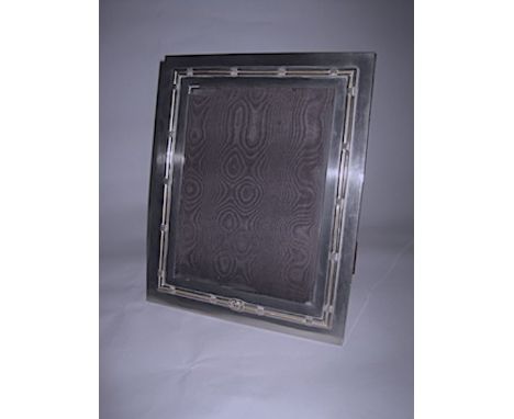  An Italian Electroplate-Mounted Easel Back Picture Frame, Gucci the rectangular body with a reed-and-ribbon rim and the Gucc