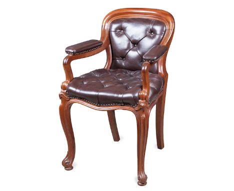  A 19th Century Mahogany Library Chair curved top, sweeping arms terminating in c-scroll shaped apron on cabriole legs with b