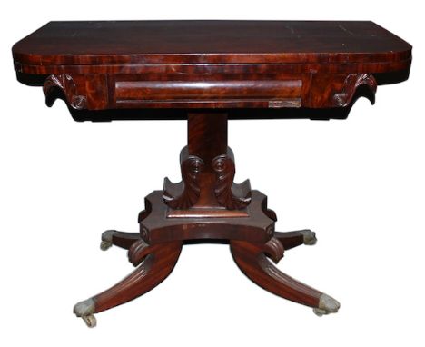  A Regency Fold Over Mahogany Card Table hinged top, panelled and carved frieze, carved leaf form mouldings to side, central 