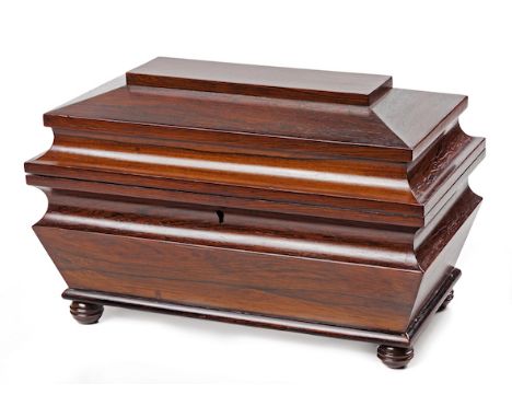  A 19th Century Rosewood Sarcophagus Shaped Tea Caddy Hinged, stepped lid, tapered body on turned bun feet, interior fitted w