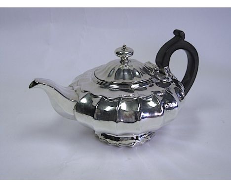  A George IV Silver Teapot, Makers Mark R P, London, 1822 the compressed melon-shaped body with fluting, applied with a turne