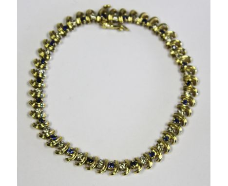  A Tanzanite and Diamond Bracelet the chain set with alternating tanzanite, weighing approximately 0,6ct in total, and diamon