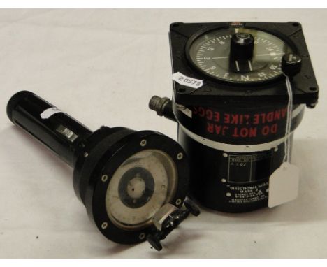 A military compass and a military hand held compass with light.