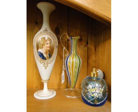 An Italian glass jug, an enamelled atomiser scent bottle and a milk glass vase with portrait decoration.