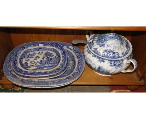 A blue and white soup tureen with ladle, Victorian willow pattern serving plates.