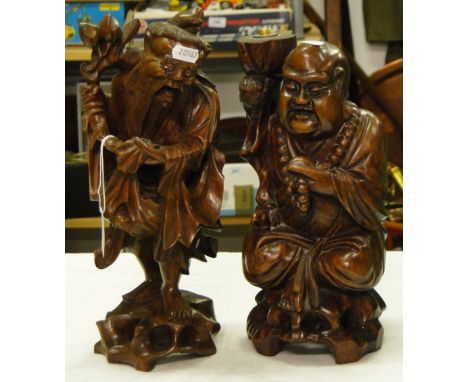 A carved Oriental figure table lamp and a carved Oriental figure.