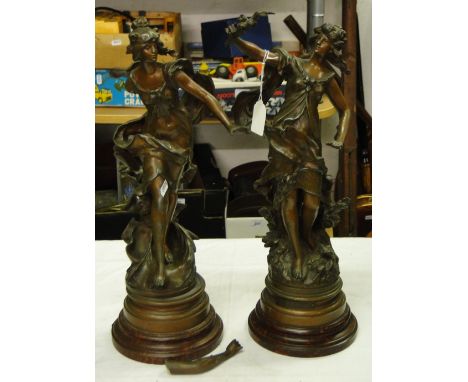 A pair of Art Nouveau patinated spelter French figures depicting 2 of the Seasons.