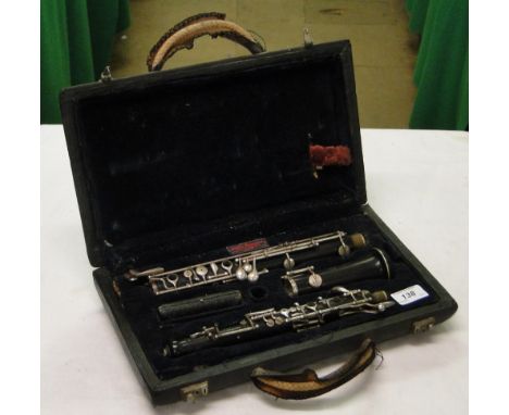 A clarinet with silver plated mounts in fitted case.