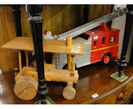 A hand built painted wood Kent fire engine and a wooden steamroller