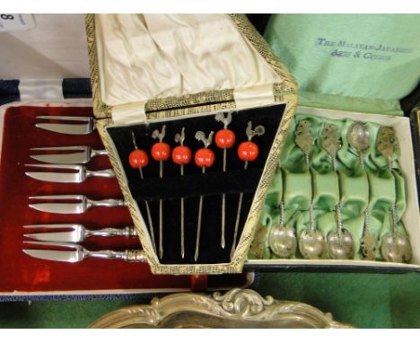 Cased set of 6 Art deco silver cocktail sticks with cockerel finials, set of 6 Oriental silver teaspoons marked 800, and a se