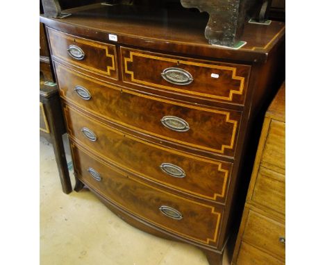 A 19th century satinwood banded mahogany bow front 5 drawer chest on bracket feet