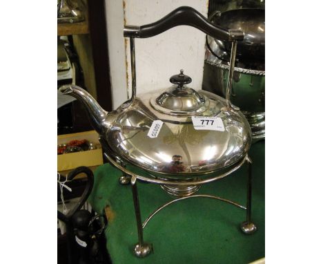 An Arts and Crafts design plated spirit kettle on stand.