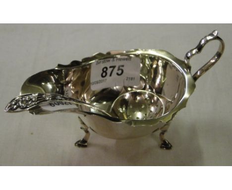 A small silver sauce boat and a silver sifter spoon, 80g