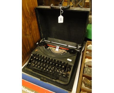 An early Oliver potable typewriter with case
