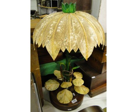 A painted metal table lamp on wooden plinth