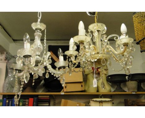 A glass chandelier with lustre drops and a similar 3-branch chandelier.