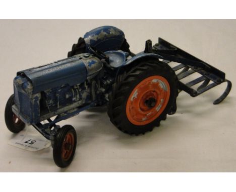 A die-cast Chad Valley tractor and rake.5