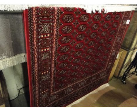 A red ground Bokhara carpet, 1.9m x 1.4m