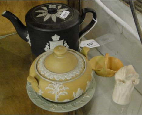 A Royal Worcester candle snuffer, a Wedgwood Jasperware teapot with armorial crest, sugar bowl and dish and a miniature Worce