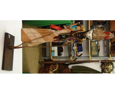 Vintage Eastern puppet on stand.
