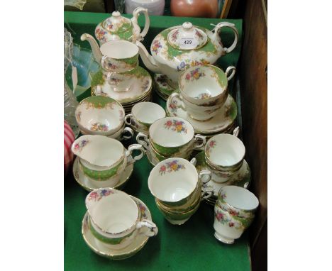 Paragon china tea service and matching coffee set in Rockingham pattern, including coffee pot and teapot.