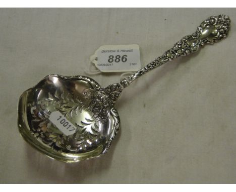 A Continental sterling silver serving spoon with pierced bowl and embossed handle, retailed by Hope Bros., 3oz