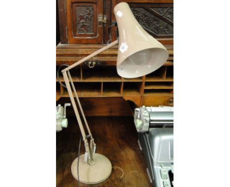 A tabletop angle poise desk lamp