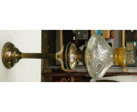 A brass Corinthian column oil lamp with shade and chimney.