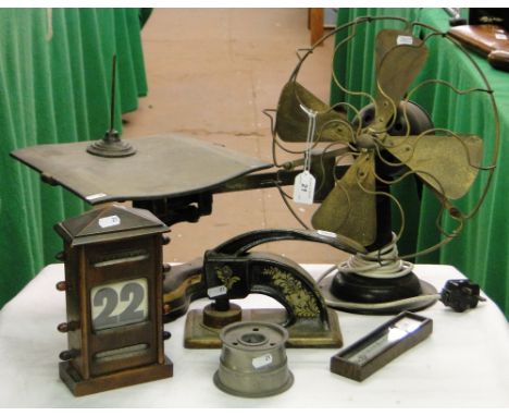 A fan, thermometer, desk top Vintage perpetual calendar, address stamp, etc.