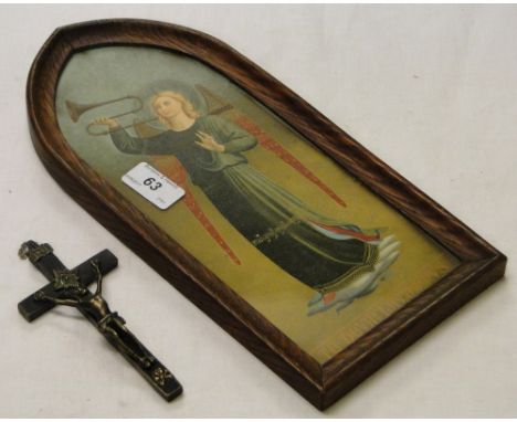A crucifix and a framed portrait of an angel.
