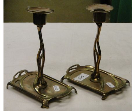 A pair of Art Nouveau brass candlesticks.