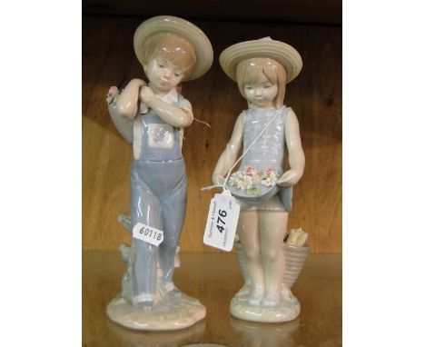 Lladro boy in dungarees with flower baskets on his back and a Lladro girl with flowers in her dress.