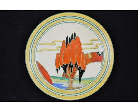 A Clarice Cliff plate in the Bizarre Solitude design, yellow and green border, printed Bizarre mark to base - diam 23cm CONDI
