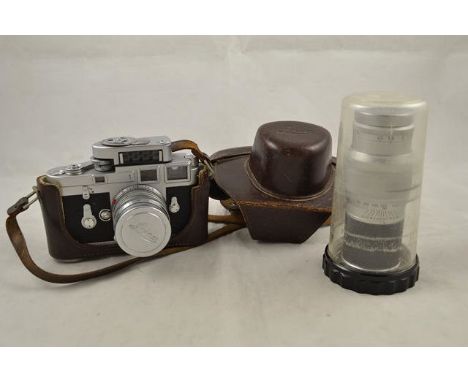 A Leica M3 camera with Summarit F5 lens, NR.1470435, MC Leica meter, leather case, Leica guarantee numbered 903025, additiona