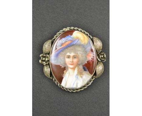 A white metal brooch set with oval porcelain miniature portrait - H 5.5cm. CONDITION REPORT: Good condition.