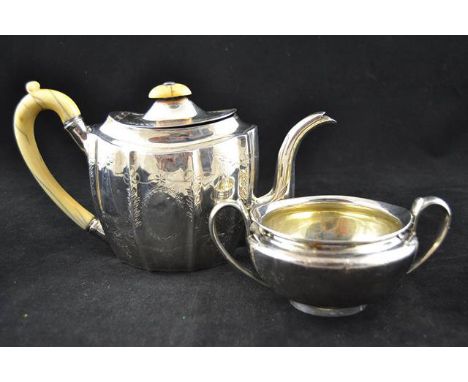 A late Georgian classical style engraved silver teapot, original ivory handle and finial, together with the matching two hand