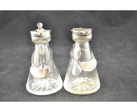 A pair of Asprey & Co silver mounted glass whisky noggins, Birmingham 1920, together with a pair of Hukin & Heath silver whis