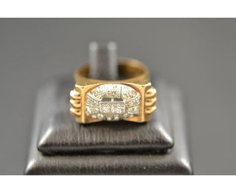 An Art Deco 'Odeonesque' 18k gold ring set with thirty diamonds, size P½.
 CONDITION REPORT: Good condition, some light scrat