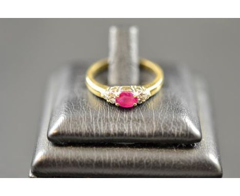 A 9ct gold ring set with ruby and diamonds, size I1/2 - approx gross weight 2.2g. CONDITION REPORT: Good condition.