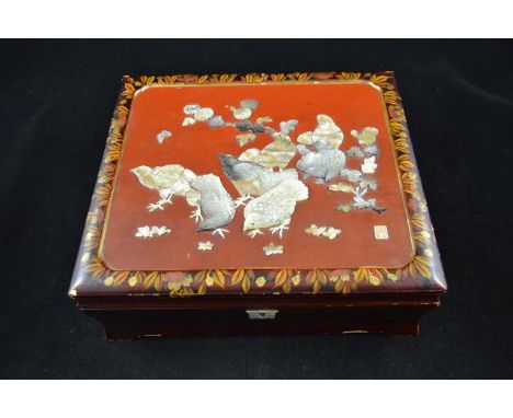 A Chinese red lacquered jewellery box mounted with mother of pearl quail, seal mark to lid - W 27cm. CONDITION REPORT: Slight