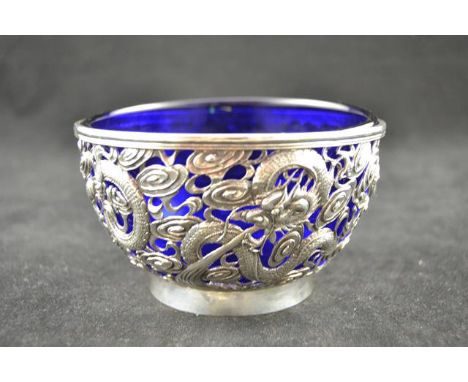 An early 20th century pierced silver bowl depicting dragons chasing pearl amongst cloud scrolls, diam 12.5cm, H7.5cm, bearing