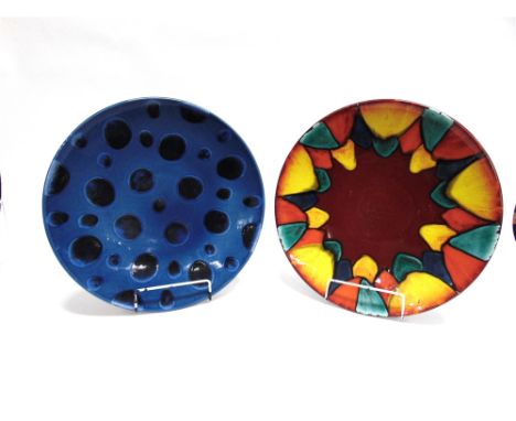 TWO POOLE POTTERY 'LIVING GLAZE' CHARGERS  one decorated in the 'Harlequin' design, the other with spots on a blue ground, bo