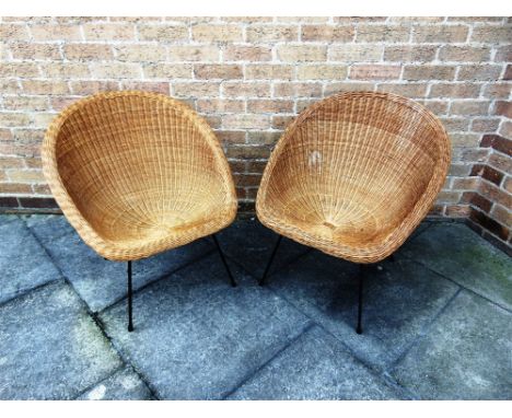A PAIR OF VINTAGE WICKER CHAIRS  with bamboo frames on metal supports, 66cm wide 66cm deep 72cm high