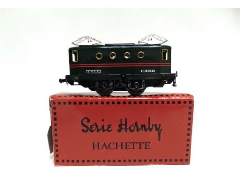 [O GAUGE]. A HACHETTE HORNBY COLLECTION  comprising an 0-4-0 tender locomotive, 2528, lined red livery, with a clockwork moto