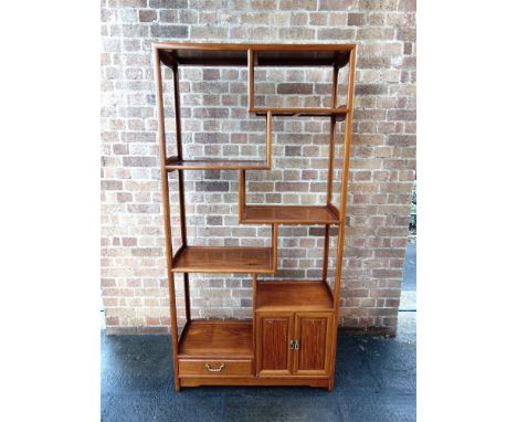 A CHINESE HARDWOOD OPEN SHELF UNIT  with drawer and cupboard to base, 91cm wide 36cm deep 83cm high