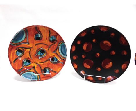 TWO POOLE POTTERY 'LIVING GLAZE' CHARGERS  one decorated in the 'Peacock' design, the other in 'Galaxy', both 40cm diameter
