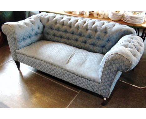 AN EDWARDIAN DROP-END CHESTERFIELD SOFA  on square tapering supports, 165cm wide 85cm deep 72cm high