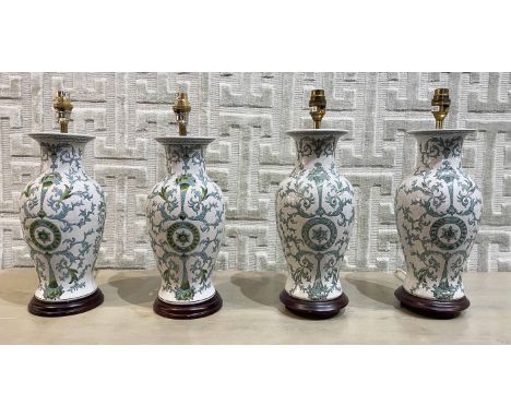 TABLE LAMPS, two pairs, Chinese ceramic vase form with carved hardwood bases, largest 42cm H. (4)