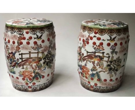 CHINESE STOOLS, a pair, mid 20th century ceramic white rustic Chinoiserie scene depicting exotic birds, blossom and cherries,